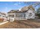 Rear view of home with a white wooden fence and large window overlooking the yard at 1639 Coventry Rd., Surfside Beach, SC 29575