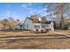 Rear view of home with a white wooden fence and large window overlooking the yard at 1639 Coventry Rd., Surfside Beach, SC 29575