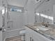 Bathroom featuring granite countertop vanity, shower with grab bars, and tile flooring at 1639 Coventry Rd., Surfside Beach, SC 29575