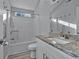 Bathroom with granite countertop, accessible shower, and modern fixtures, combining style with accessibility at 1639 Coventry Rd., Surfside Beach, SC 29575