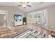 Bedroom showcasing bay windows, sleek gray flooring, and modern furnishings with a calming aesthetic at 1639 Coventry Rd., Surfside Beach, SC 29575