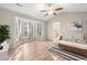 Open bedroom showcases a bay window and a glimpse of the en suite bathroom at 1639 Coventry Rd., Surfside Beach, SC 29575