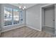 Cozy dining area features a chandelier and large windows with views of the backyard and neighborhood at 1639 Coventry Rd., Surfside Beach, SC 29575