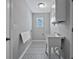 Functional laundry room featuring a utility sink, folding table, and decorative flooring at 1639 Coventry Rd., Surfside Beach, SC 29575