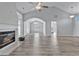 Bright and open living room with vaulted ceilings, a fireplace, and modern flooring, creating a spacious feel at 1639 Coventry Rd., Surfside Beach, SC 29575