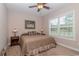 Comfortable bedroom with a ceiling fan and neutral decor offers a peaceful space to relax and unwind at 1796 Fairwinds Dr., Longs, SC 29568