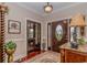 Inviting foyer with a decorative front door, hardwood floors, and elegant decor welcomes you into this home at 1796 Fairwinds Dr., Longs, SC 29568