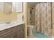 Cozy bathroom with a vanity, integrated sink, and a shower-tub combo with a decorative curtain at 180 Rothbury Circle # 303, Myrtle Beach, SC 29572