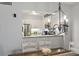 Dining area with view to kitchen with stainless steel refrigerator and granite counters at 180 Rothbury Circle # 303, Myrtle Beach, SC 29572