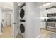 Convenient laundry closet with stacked washer and dryer and storage at 180 Rothbury Circle # 303, Myrtle Beach, SC 29572