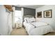 Stylishly decorated bedroom featuring modern decor, a plush upholstered headboard, and a neutral color palette at 1808 Sunshine Ct., North Myrtle Beach, SC 29582