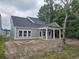 Inviting back porch with columns, perfect for relaxing in the outdoors at 1808 Sunshine Ct., North Myrtle Beach, SC 29582