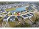 Drone shot of the neighborhood showcasing the home and a large pond at 188 Timber Oaks Dr., Myrtle Beach, SC 29588