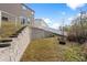 Backyard featuring a retaining wall, terraced yard, and access to the home's sliding door at 188 Timber Oaks Dr., Myrtle Beach, SC 29588