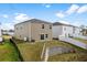 Spacious backyard with a retaining wall and terraced landscape leading up to the home at 188 Timber Oaks Dr., Myrtle Beach, SC 29588