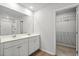 Modern bathroom showcasing a double sink vanity and linen closet at 188 Timber Oaks Dr., Myrtle Beach, SC 29588