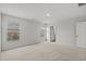 A bright bedroom features neutral walls, carpeted floors, and two large windows at 188 Timber Oaks Dr., Myrtle Beach, SC 29588