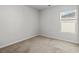 Comfortable bedroom featuring carpet flooring and a large window at 188 Timber Oaks Dr., Myrtle Beach, SC 29588