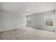 A bright bedroom featuring neutral walls, carpeted floors, and two large windows at 188 Timber Oaks Dr., Myrtle Beach, SC 29588