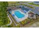 Aerial view of the community pool, lounge area, playground, and landscaping at 188 Timber Oaks Dr., Myrtle Beach, SC 29588