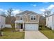 Inviting two-story home showcasing a two-car garage and manicured front lawn at 188 Timber Oaks Dr., Myrtle Beach, SC 29588