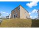 View of home from the rear showcasing vinyl siding, patio, and landscaped backyard on a sunny day at 188 Timber Oaks Dr., Myrtle Beach, SC 29588