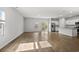 Open-concept living area with wood floors, natural light, and adjacent kitchen at 188 Timber Oaks Dr., Myrtle Beach, SC 29588