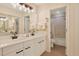 Bright bathroom with a double sink vanity, decorative mirrors and a shower and bath combo at 222 Westleton Dr. # 18D, Myrtle Beach, SC 29572