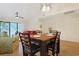 Dining area adjacent to the living room, with seating for four, and modern lighting at 222 Westleton Dr. # 18D, Myrtle Beach, SC 29572