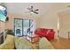 Living room featuring a fireplace, ceiling fan, and sliding glass doors to the balcony at 222 Westleton Dr. # 18D, Myrtle Beach, SC 29572