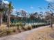 Well maintained community tennis courts surrounded by trees at 222 Westleton Dr. # 18D, Myrtle Beach, SC 29572