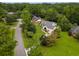 Overhead view of a wooded community with a home, driveway, and well-maintained landscaping at 2264 Wedgefield Rd., Georgetown, SC 29440