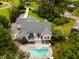 Stunning aerial view of the house showcasing the pool, deck, landscaped yard, and surrounding neighborhood at 2264 Wedgefield Rd., Georgetown, SC 29440