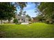 Spacious backyard featuring an in-ground pool, deck and a well-maintained lawn, great for outdoor activities at 2264 Wedgefield Rd., Georgetown, SC 29440