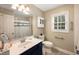 Charming bathroom featuring a nautical themed shower curtain and a stylish vanity with a white countertop at 2264 Wedgefield Rd., Georgetown, SC 29440