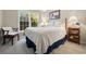 Cozy bedroom with natural light from large window, wooden furnishings, and neutral color palette at 2264 Wedgefield Rd., Georgetown, SC 29440