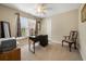 Bright bedroom with a workspace featuring a wooden desk, chair, and large window at 2264 Wedgefield Rd., Georgetown, SC 29440