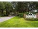 Wedgefield Plantation entrance with brick signage, lush landscaping, and picturesque setting with mature trees at 2264 Wedgefield Rd., Georgetown, SC 29440