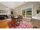 Cozy dining area featuring hardwood floors, dining table set, and view of the outdoor patio at 2264 Wedgefield Rd., Georgetown, SC 29440