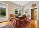 Elegant dining area with wood table, and view of the outdoor patio and pool at 2264 Wedgefield Rd., Georgetown, SC 29440