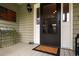 Inviting entryway with well-lit front door, American flag decor, and potted plant at 2264 Wedgefield Rd., Georgetown, SC 29440