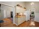 An open-concept kitchen featuring hardwood floors, granite countertops and bright lighting at 2264 Wedgefield Rd., Georgetown, SC 29440