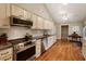 Bright kitchen with granite countertops, stainless steel appliances and hardwood floors at 2264 Wedgefield Rd., Georgetown, SC 29440