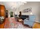 Spacious living room with high ceilings, decorative rug, chandelier and comfortable seating at 2264 Wedgefield Rd., Georgetown, SC 29440