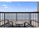 Relax on this condo balcony with ocean views, seating, and a small table to set your drinks and snacks at 2311 S Ocean Blvd. # 969, Myrtle Beach, SC 29577