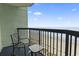 Relax on this cozy condo balcony with ocean views, seating, and a small table for drinks and snacks at 2311 S Ocean Blvd. # 969, Myrtle Beach, SC 29577