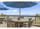 Enjoy a meal with ocean views on this condo's outdoor restaurant seating area, covered by large umbrellas at 2311 S Ocean Blvd. # 969, Myrtle Beach, SC 29577