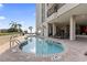 An outdoor pool with several lounge chairs and hotel rooms on the upper floors at 2311 S Ocean Blvd. # 969, Myrtle Beach, SC 29577