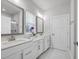 Modern bathroom with double sink vanity, large mirrors, and bright lighting at 2341 Hazel Way, Longs, SC 29568