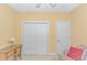 Comfortable bedroom featuring neutral walls, double closets, and a desk at 25 Berwick Dr., Pawleys Island, SC 29585